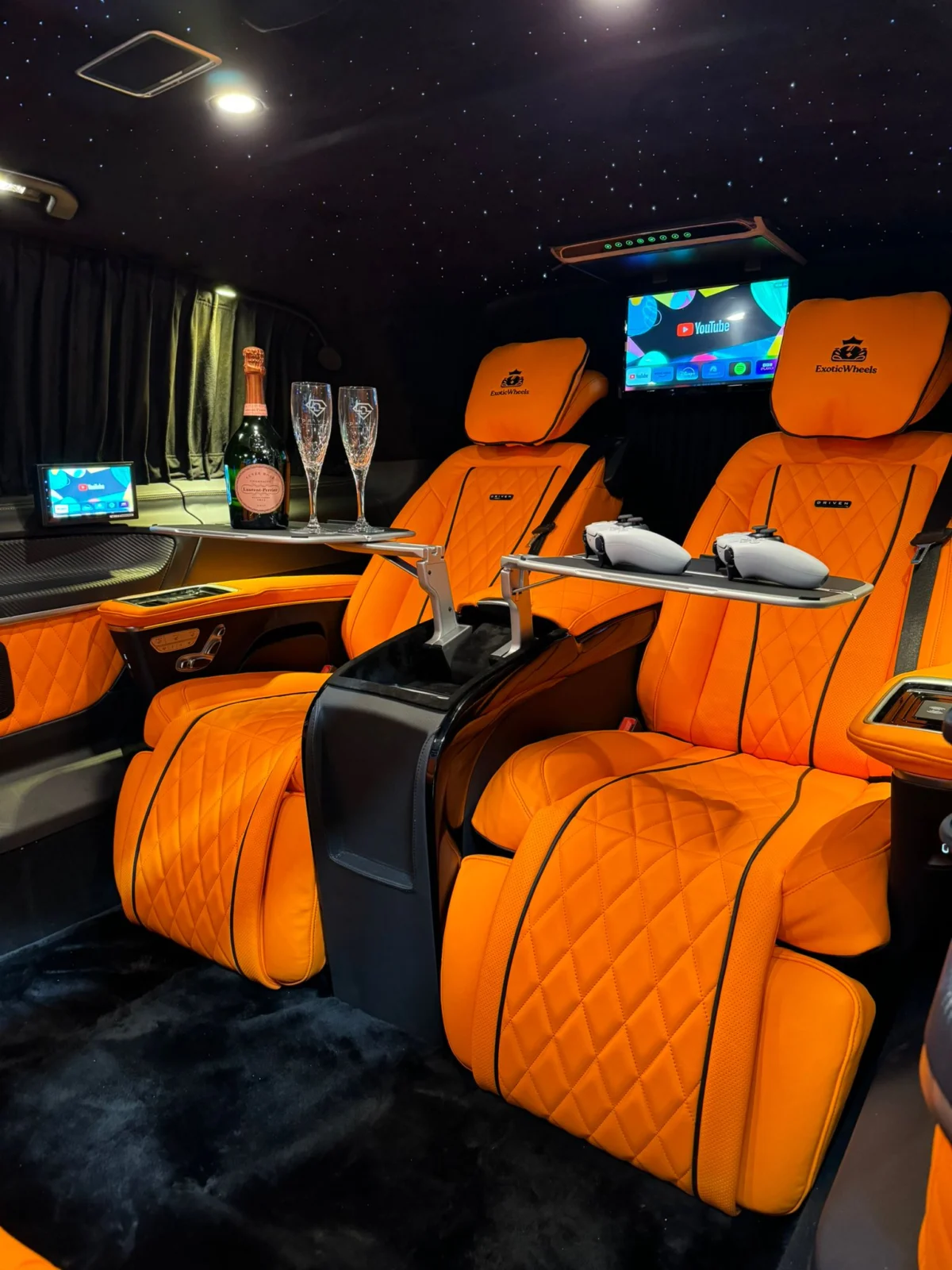 Orange leather Jet-Class luxury cabin with ambient lighting and onboard entertainment